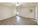 Primary bedroom with modern floors, a ceiling fan, and abundant natural light at 2012 Elm Grove Ln, Hampton, GA 30228