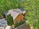 Aerial view of brick home with a gray roof and green foliage surrounding the property at 318 Dogwood Trce, Mcdonough, GA 30252