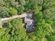 Overhead view of home with a long, curved driveway and plenty of trees offering privacy at 318 Dogwood Trce, Mcdonough, GA 30252