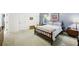Spacious bedroom with a wooden bed frame, neutral walls, and large windows for natural light at 318 Dogwood Trce, Mcdonough, GA 30252