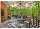 Spacious deck with outdoor furniture provides a relaxing space overlooking the lush backyard at 318 Dogwood Trce, Mcdonough, GA 30252