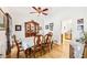 Traditional dining room with hardwood floors, white walls, and a vintage china cabinet at 318 Dogwood Trce, Mcdonough, GA 30252