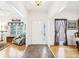 Spacious entryway offers hardwood floors with views into the living spaces, with lovely front door at 318 Dogwood Trce, Mcdonough, GA 30252