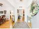 Inviting entryway features beautiful tile leading to hardwood floors, with views of the dining room and living area at 318 Dogwood Trce, Mcdonough, GA 30252
