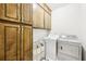 Laundry room featuring wood cabinets and a new washer and dryer at 318 Dogwood Trce, Mcdonough, GA 30252