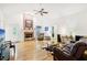 Bright living room boasts vaulted ceilings, fireplace, hardwood floors, and natural light at 318 Dogwood Trce, Mcdonough, GA 30252