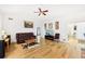 Large living room with hardwood floors, vaulted ceilings, and open layout at 318 Dogwood Trce, Mcdonough, GA 30252
