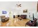 Spacious living room featuring hardwood floors, vaulted ceilings, and ample natural light at 318 Dogwood Trce, Mcdonough, GA 30252