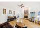 Cozy living room boasts hardwood floors, vaulted ceilings, and fireplace at 318 Dogwood Trce, Mcdonough, GA 30252