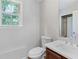 Bathroom featuring modern fixtures, wood cabinet, and a bright window at 3315 Brookfield Dr, Austell, GA 30106