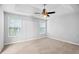 Spacious bedroom with carpet, two windows, and a tray ceiling at 3315 Brookfield Dr, Austell, GA 30106