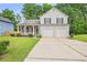 Charming two-story home with a well-maintained lawn and a two-car garage at 3315 Brookfield Dr, Austell, GA 30106