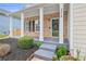 Inviting front porch with classic brick accents and a well-manicured garden at 3315 Brookfield Dr, Austell, GA 30106