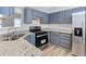 Modern kitchen with granite countertops, stainless steel appliances and ample cabinet space at 3315 Brookfield Dr, Austell, GA 30106