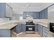 Well-lit kitchen featuring stainless steel appliances and subway tile backsplash at 3315 Brookfield Dr, Austell, GA 30106
