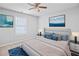 Main bedroom with a king-size bed, blue accent pillows, and serene decor at 3315 Brookfield Dr, Austell, GA 30106