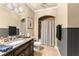 Well-lit bathroom with granite vanity, stylish fixtures, and shower-tub combo at 4190 Madison Dr, Cumming, GA 30040