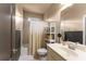 Tiled bathroom with bathtub, shower, and vanity at 4190 Madison Dr, Cumming, GA 30040