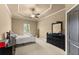 Well lit bedroom with stylish fan, a dresser and large window at 4190 Madison Dr, Cumming, GA 30040