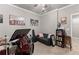Music room with drum set, black couch, and rock-n-roll memorabilia creates a relaxing atmosphere at 4190 Madison Dr, Cumming, GA 30040
