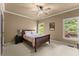 Cozy bedroom with natural light, neutral paint, and en-suite bathroom access at 4190 Madison Dr, Cumming, GA 30040