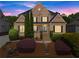 Charming two-story brick home with manicured landscaping, a brick walkway, and a welcoming front entrance at 4190 Madison Dr, Cumming, GA 30040