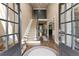 Grand foyer with soaring ceilings, elegant staircase, hardwood floors, and abundant natural light at 4190 Madison Dr, Cumming, GA 30040