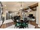 Spacious open kitchen with stainless steel appliances, stone columns, breakfast nook, and living room view at 4190 Madison Dr, Cumming, GA 30040