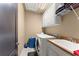 Modern laundry room equipped with machines, a sink, and ample storage at 4190 Madison Dr, Cumming, GA 30040