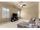 Spacious living room with comfortable sofa, media center, and window at 4190 Madison Dr, Cumming, GA 30040
