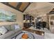 Open concept living room featuring hardwood floors, a cozy sofa, and decorative art piece above at 4190 Madison Dr, Cumming, GA 30040