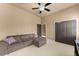 Cozy living room with sectional sofa, ample closet space, and ceiling fan at 4190 Madison Dr, Cumming, GA 30040