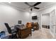 Office featuring a ceiling fan, desk, and an opened doorway leading to another room at 4190 Madison Dr, Cumming, GA 30040
