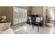 Bright home office featuring plantation shutters, neutral paint, and sleek, modern desk setup at 4190 Madison Dr, Cumming, GA 30040