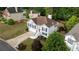 Aerial view of a well-maintained two-story home with lush landscaping and a driveway, showcasing its curb appeal at 440 Hickory Glen Sw Ln, Atlanta, GA 30311