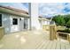 View of spacious back deck that includes railing, a door to the house, and stairs leading down to the backyard at 440 Hickory Glen Sw Ln, Atlanta, GA 30311