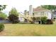 Spacious backyard with large deck, ample lawn space, and mature trees at 440 Hickory Glen Sw Ln, Atlanta, GA 30311