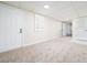 Large basement featuring carpet, tile, and a shuttered window at 440 Hickory Glen Sw Ln, Atlanta, GA 30311