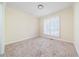 Cozy bedroom featuring plush carpeting and a window with white shutters, providing a comfortable and private space at 440 Hickory Glen Sw Ln, Atlanta, GA 30311