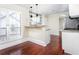 Charming breakfast nook with hardwood floors, modern lighting, and access to the kitchen featuring granite counters at 440 Hickory Glen Sw Ln, Atlanta, GA 30311