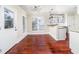 Inviting breakfast nook with hardwood floors, modern lighting, and access to the kitchen, perfect for casual dining at 440 Hickory Glen Sw Ln, Atlanta, GA 30311