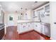 Modern kitchen with stainless steel appliances, granite countertops, white cabinets, and hardwood floors, offering style and function at 440 Hickory Glen Sw Ln, Atlanta, GA 30311