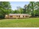 Expansive backyard featuring a charming, fenced-in yard perfect for outdoor enjoyment at 6292 Field Glen Rd, Stone Mountain, GA 30087