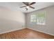 This bedroom has attractive wood flooring and a large window for natural light at 6292 Field Glen Rd, Stone Mountain, GA 30087