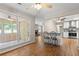 Dining area with breakfast bar and views into the kitchen and sunroom at 6292 Field Glen Rd, Stone Mountain, GA 30087
