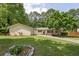 Charming one-story home features a well-manicured lawn and a quaint, inviting facade at 6292 Field Glen Rd, Stone Mountain, GA 30087