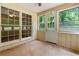 Bright sunroom featuring multiple windows offering views of the backyard at 6292 Field Glen Rd, Stone Mountain, GA 30087