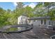 Back exterior of home with above-ground pool and deck, fenced backyard at 2675 Paul Thomas Dr, Dacula, GA 30019