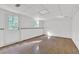 Finished basement with wood-look floors, a small window and a white-painted door at 2675 Paul Thomas Dr, Dacula, GA 30019