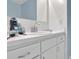 Bathroom with bright white vanity, mirror, and plenty of counter space at 2675 Paul Thomas Dr, Dacula, GA 30019